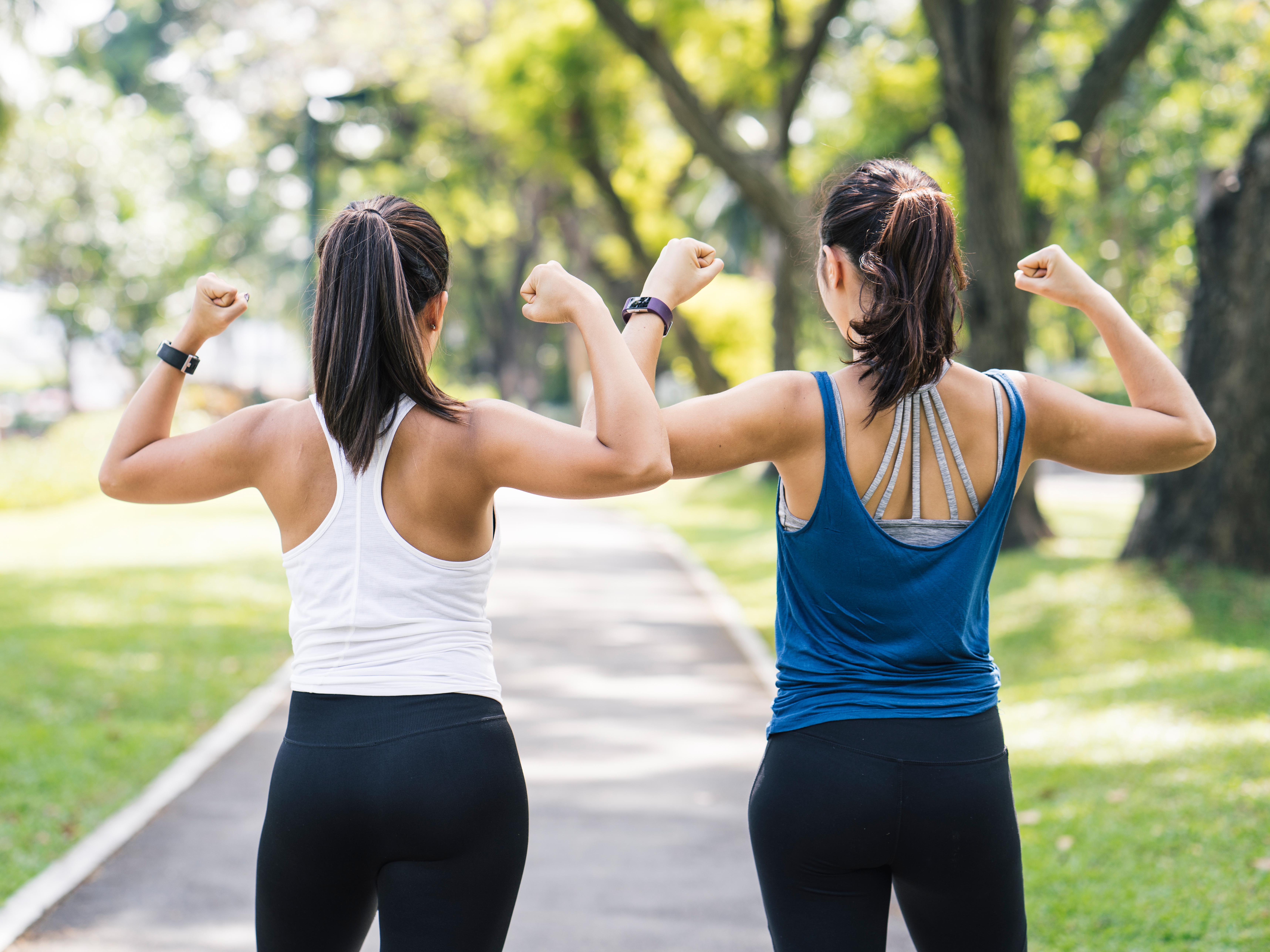 Portrait of two women at the park while jogging
