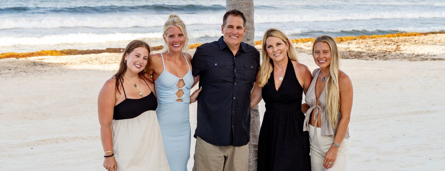 Dr. Grothaus smiling at the camera with his family. 