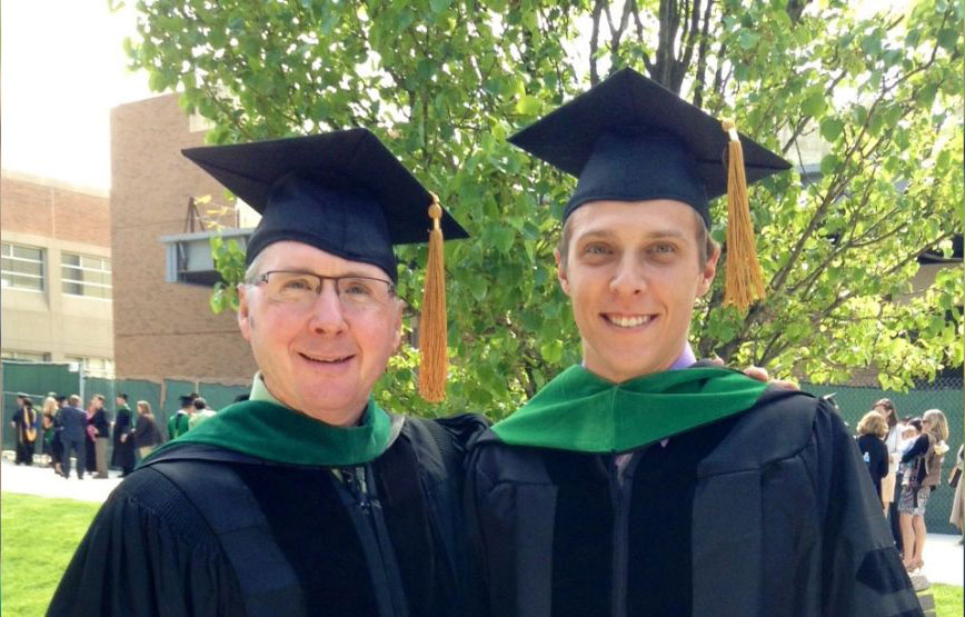 Dr. Nick Doman and his father in their academic regalia