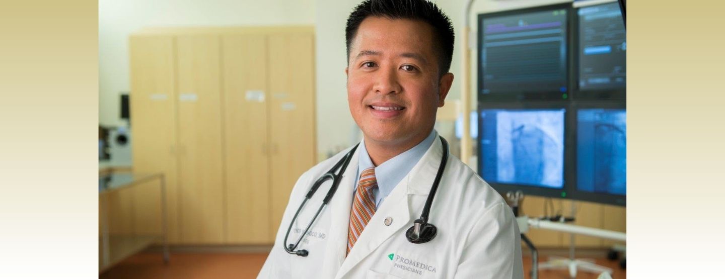 Dr. Songco smiles at the camera in a clinical setting.