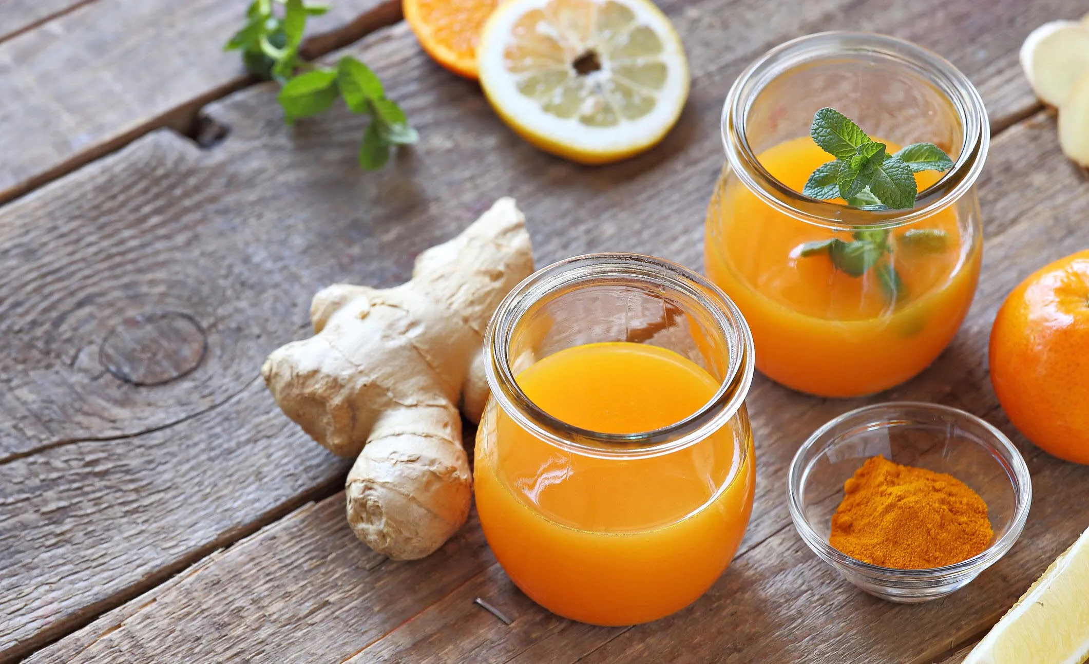 Ginger shot with citrus fruits juice, turmeric and honey.