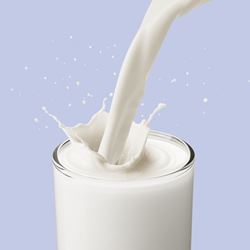 Milk pouring into glass.