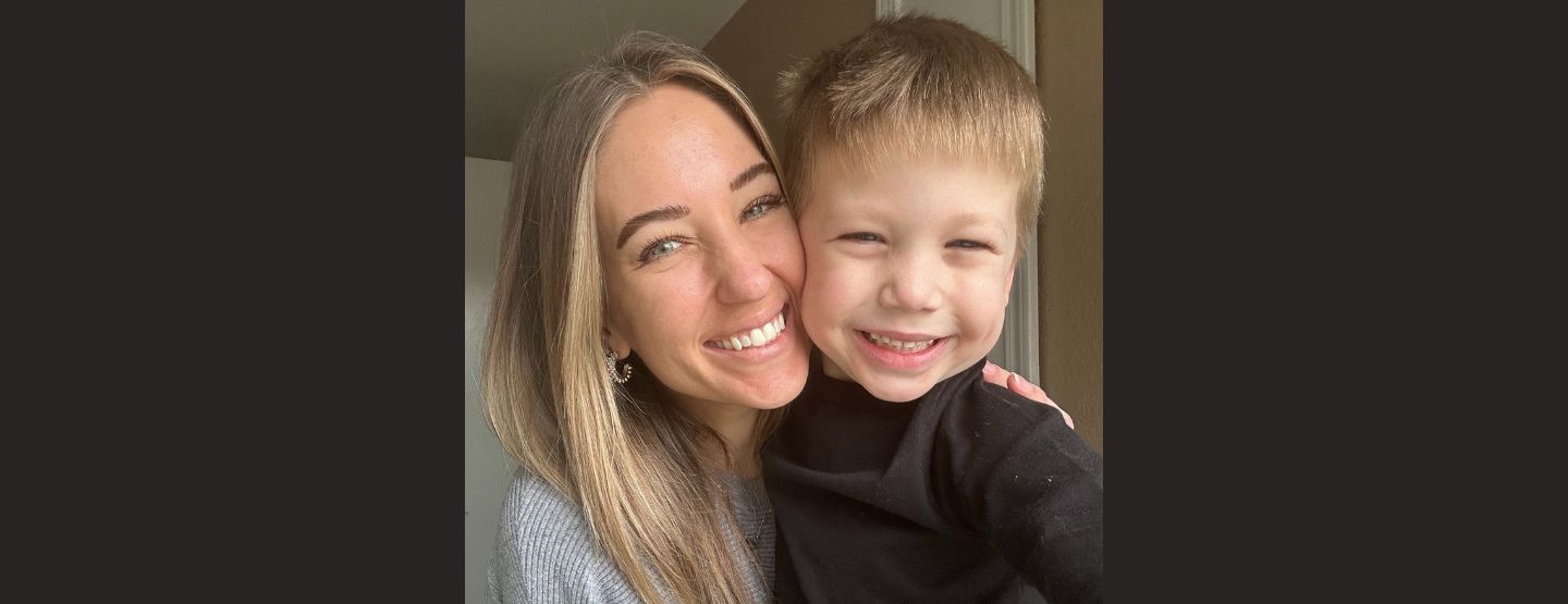 Close-up photo of Paris Lee smiling with her young son.