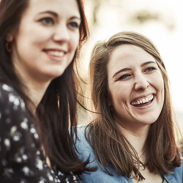 Two women smiling