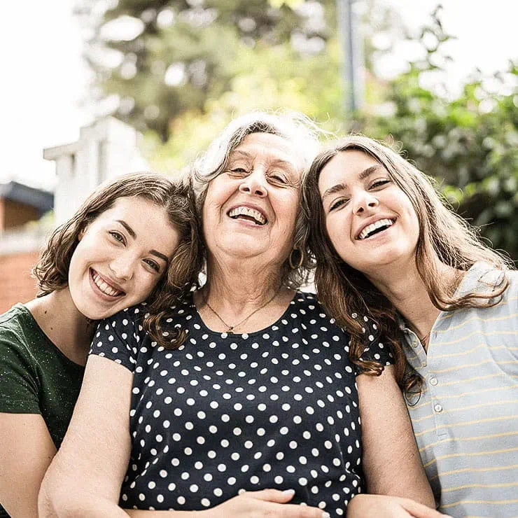 Three women smiling