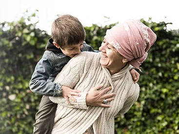 Woman carrying child