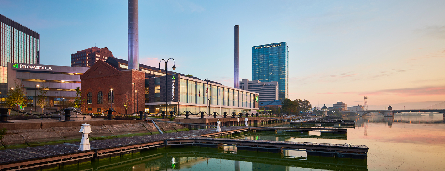 An exterior shot of ProMedica medical buildings near water in Downtown Toledo