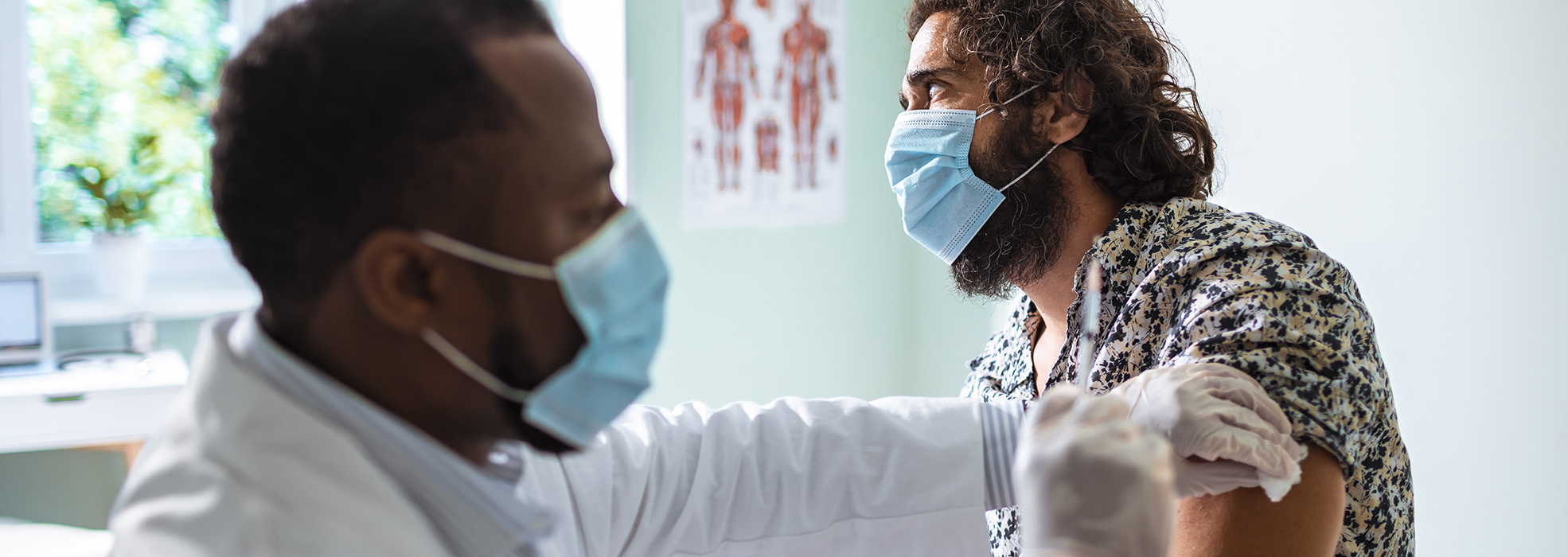 care provider gives patient a shot 