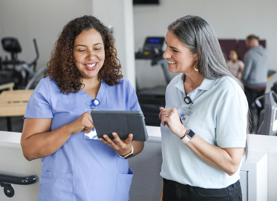 an occupational health consultant discusses a patient with a physical therapy nurse