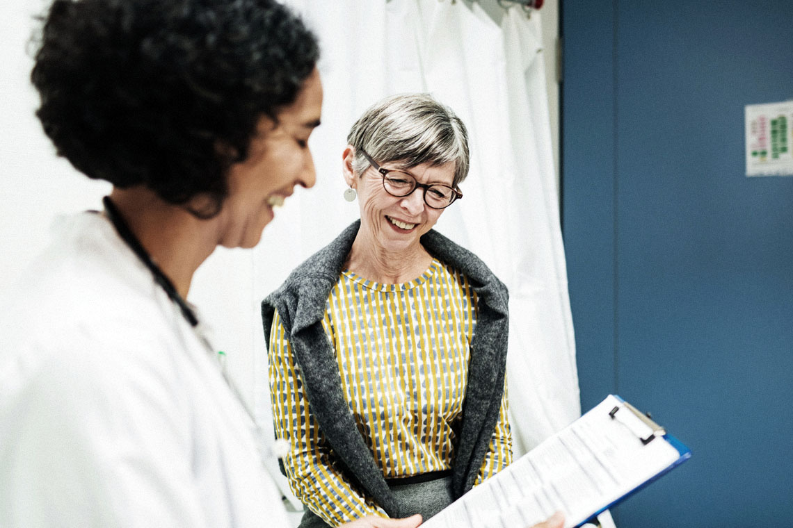 a doctor explains test results to her patient